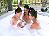 Three busty girls in a Jacuzzi