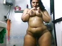 Wide hipped Indian girl takes a shower